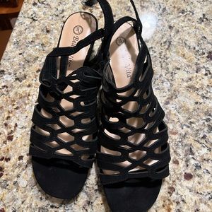 New women’s black sandal, size 10, never worn. Leather with suede on top.